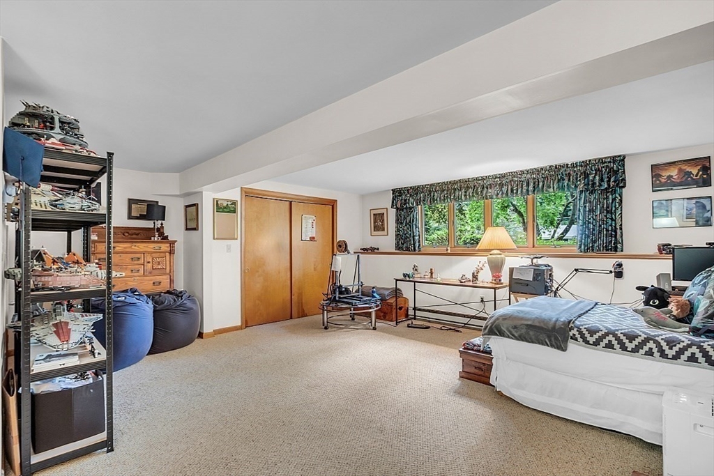 4 Belfast Road Peabody, MA 01960 - Photo 28 of 34 a bedroom with furniture and a large window