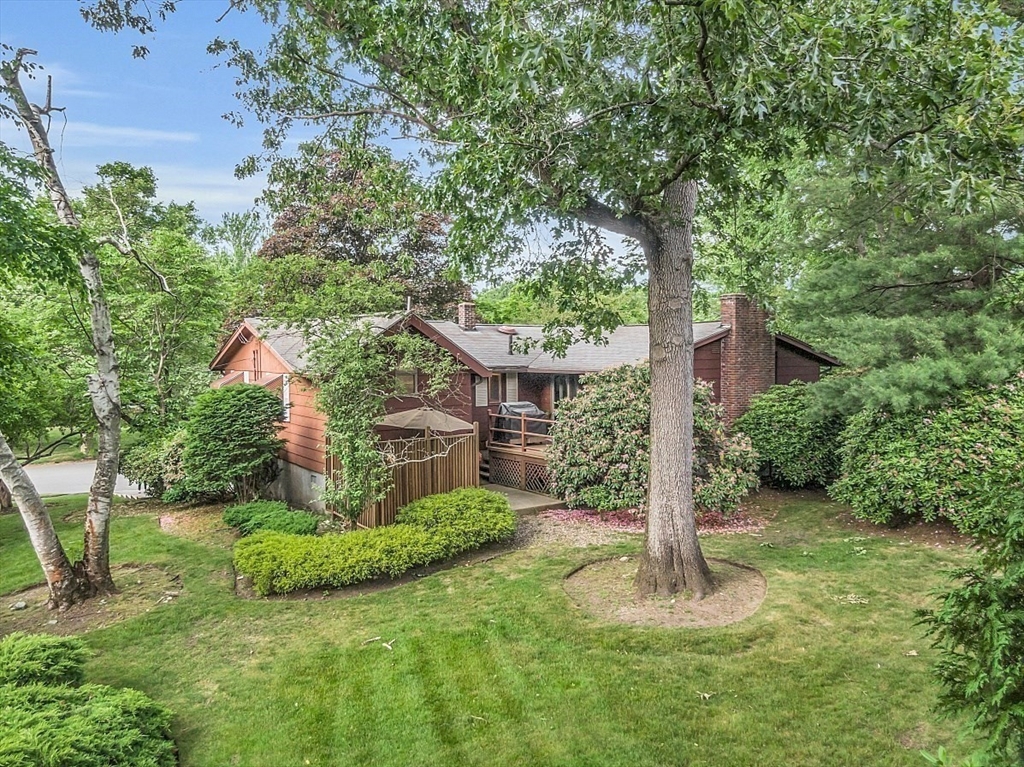 4 Belfast Road Peabody, MA 01960 - Photo 31 of 34 a view of a house with a yard and potted plants