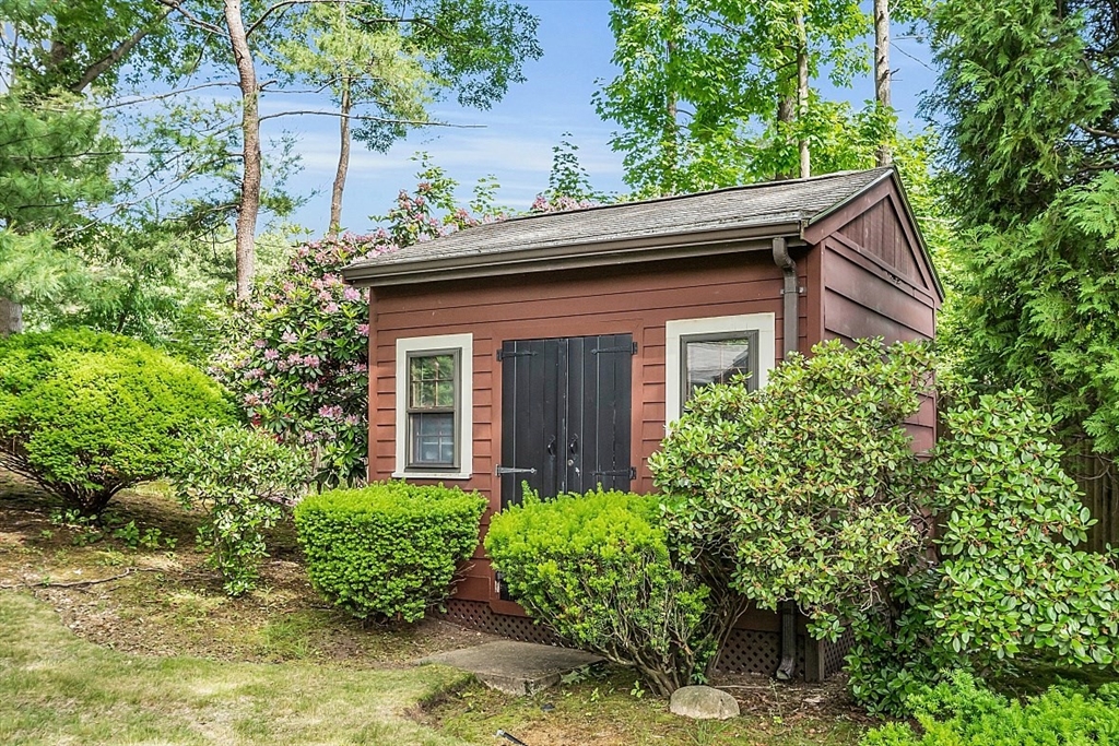 4 Belfast Road Peabody, MA 01960 - Photo 34 of 34 a brick house with potted plants in front of it