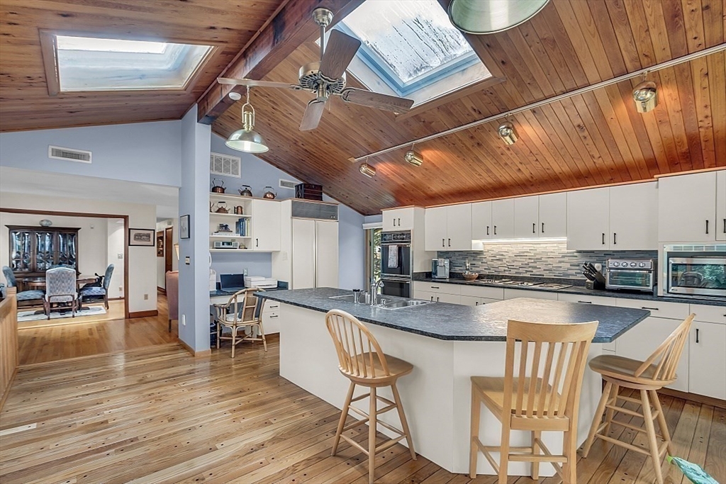4 Belfast Road Peabody, MA 01960 - Photo 10 of 34 a kitchen with stainless steel appliances granite countertop a stove sink and cabinets