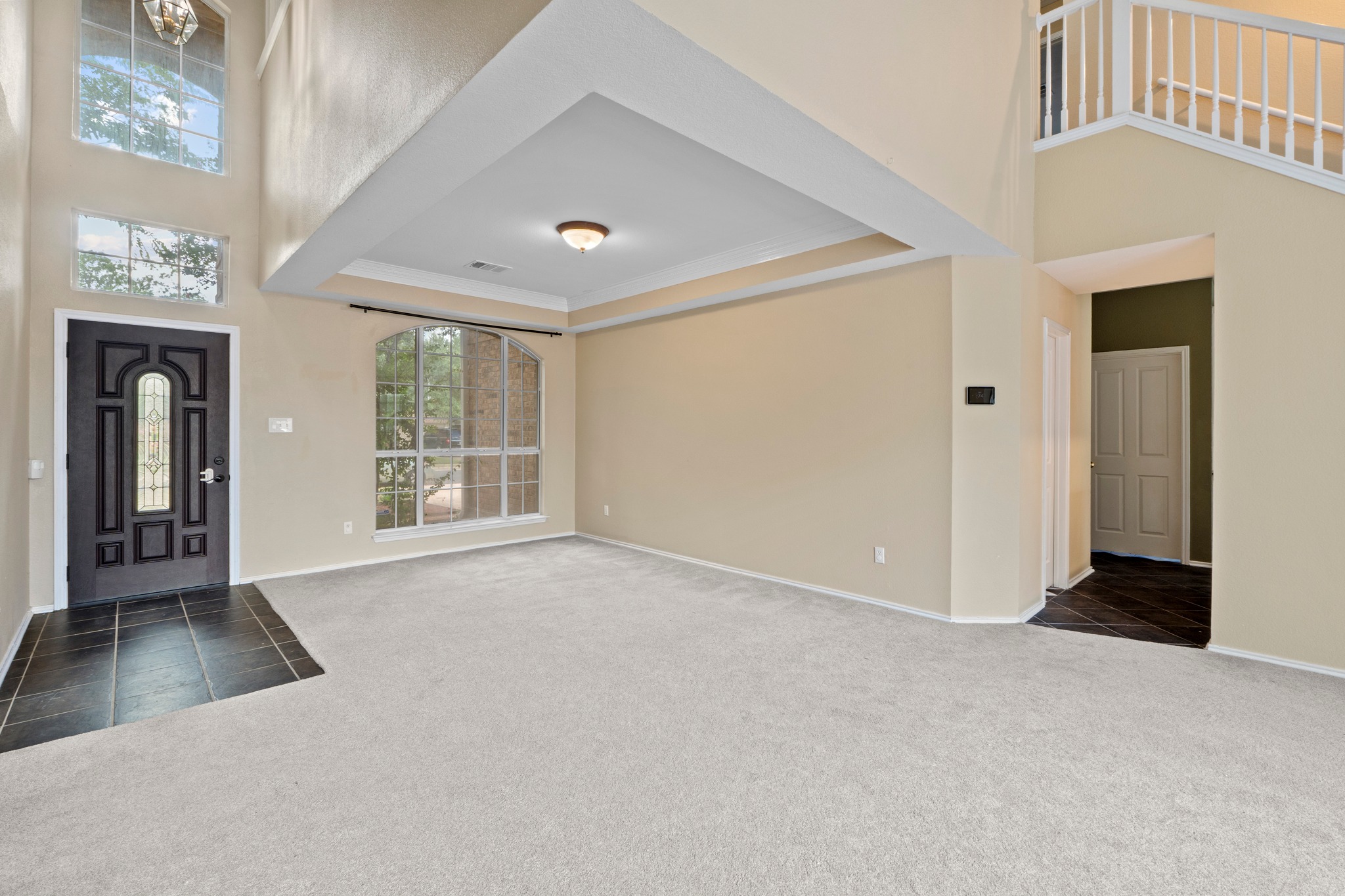 8605 Axis Drive Austin, TX 78749 - Photo 6 of 38 A spacious living area with soaring ceilings and abundant natural light.