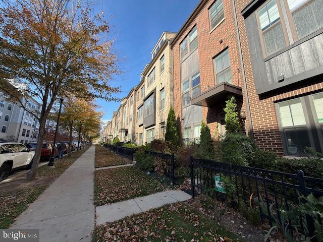 4638 Woodberry Street Riverdale, MD 20737 - Photo 57 of 78 Charming townhomes line a vibrant street.