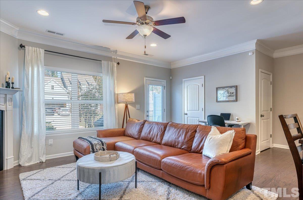 6328 Grace Lily Drive Raleigh, NC 27607 - Photo 12 of 27 a living room with furniture and a large window