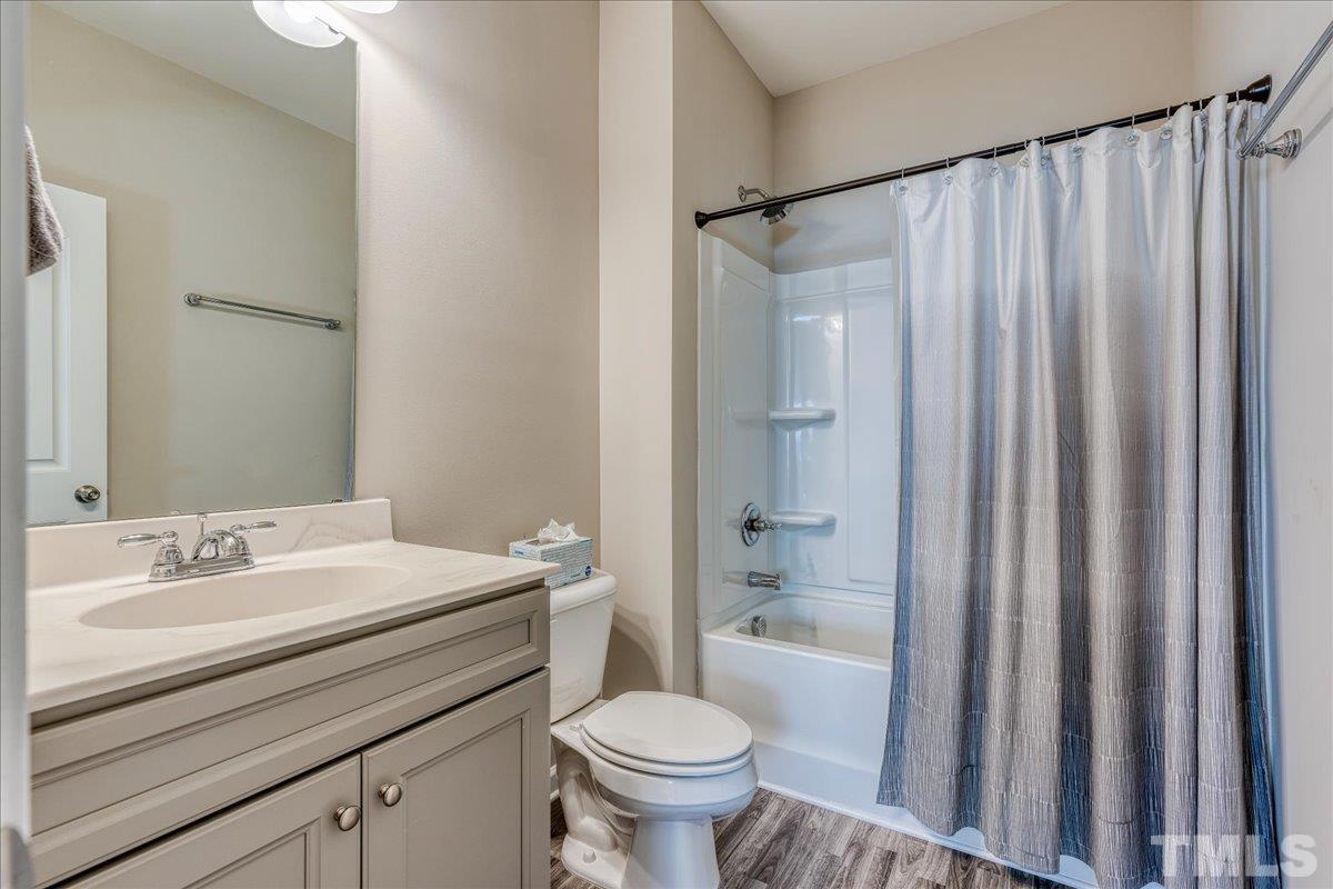 6328 Grace Lily Drive Raleigh, NC 27607 - Photo 15 of 27 a bathroom with a sink toilet and shower