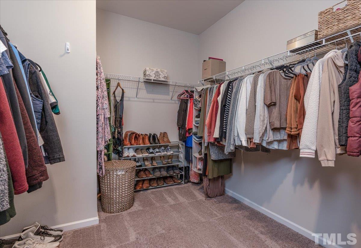 6328 Grace Lily Drive Raleigh, NC 27607 - Photo 25 of 27 a view of walk in closet with clothes and shoes
