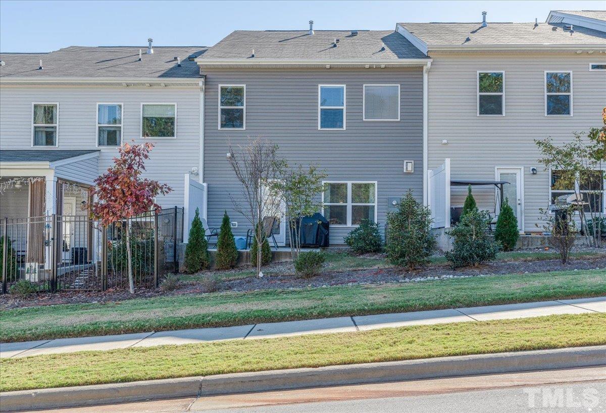 6328 Grace Lily Drive Raleigh, NC 27607 - Photo 27 of 27 a front view of a house with a yard