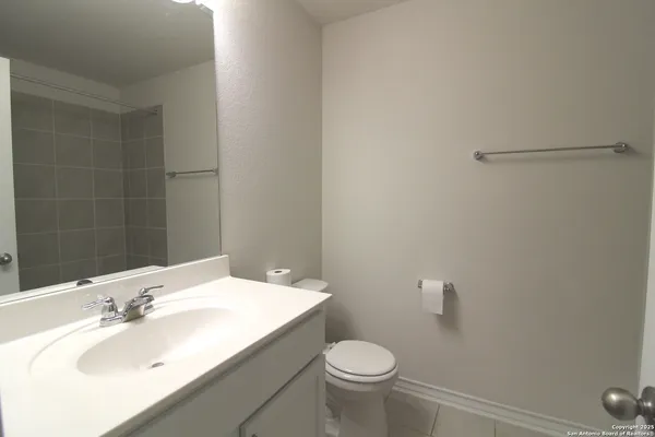 a bathroom with a sink toilet and vanity