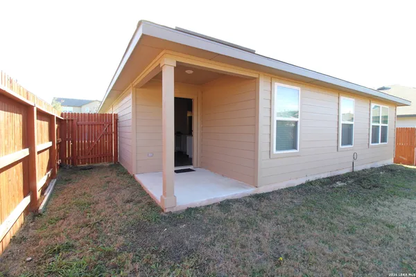 a view of backyard with cabin