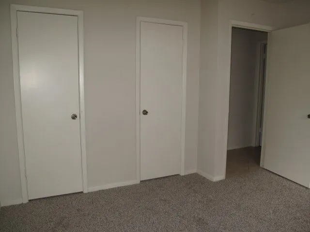 a view of hallway with closet