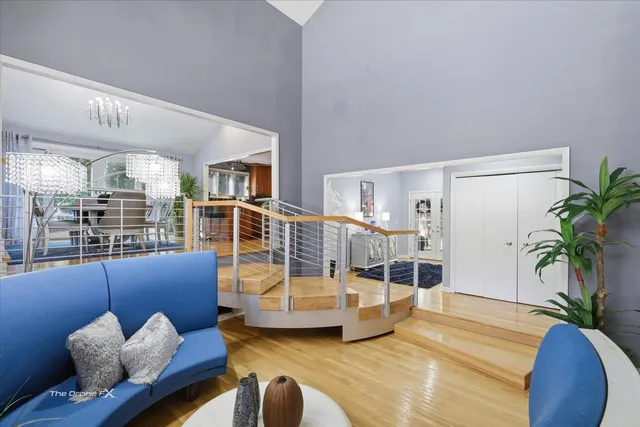 a kitchen with stainless steel appliances kitchen island granite countertop a table and chairs in it