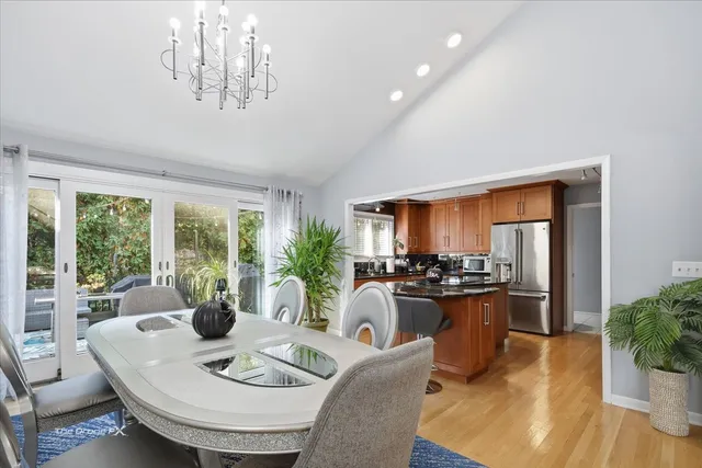 a kitchen with stainless steel appliances a refrigerator sink and microwave