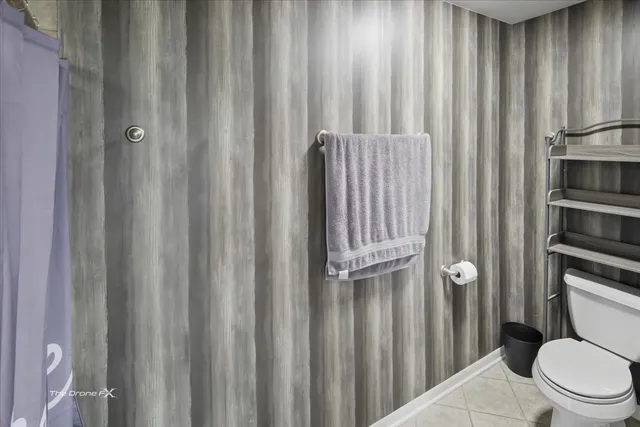 a utility room with a sink a washer and dryer next to a window