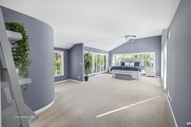 a bedroom with a bed window and a table