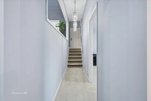 a spacious bedroom with a bed and a large window