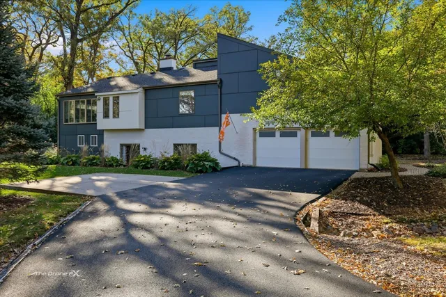 a backyard of a house with yard and outdoor seating