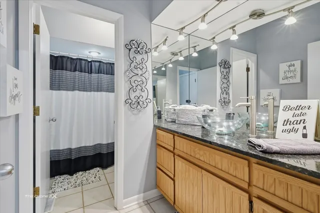 a picture of a wall with a white bed