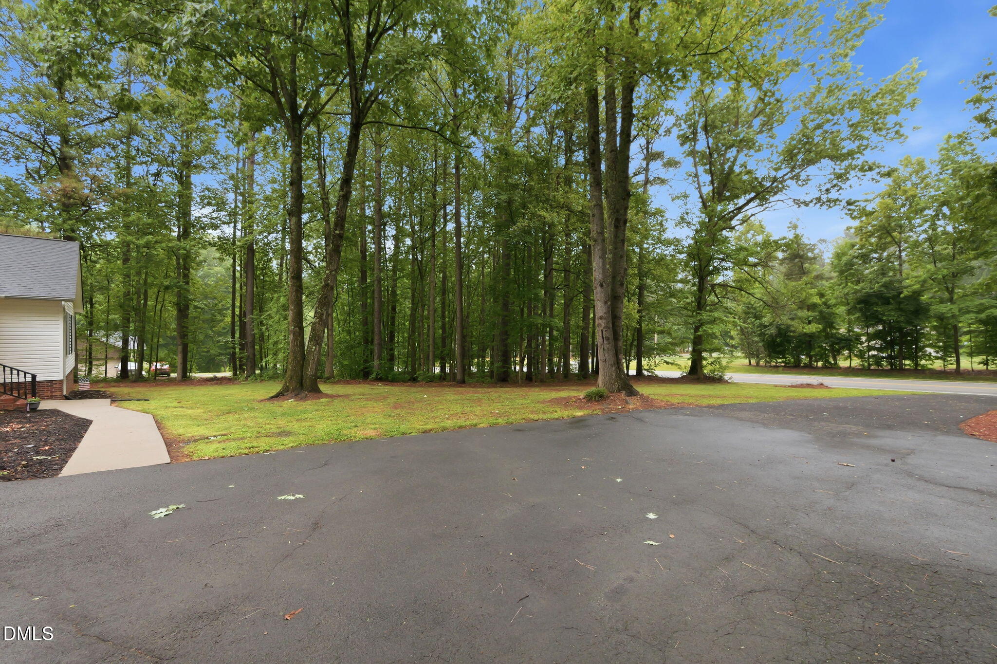 1925 Old Allensville Road Roxboro, NC 27574 - Photo 9 of 58 a view of a house with large trees and a big yard