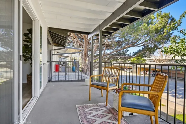 a view of a chairs and table in the patio