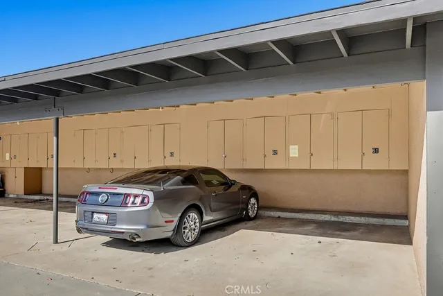 a view of parking garage with cars