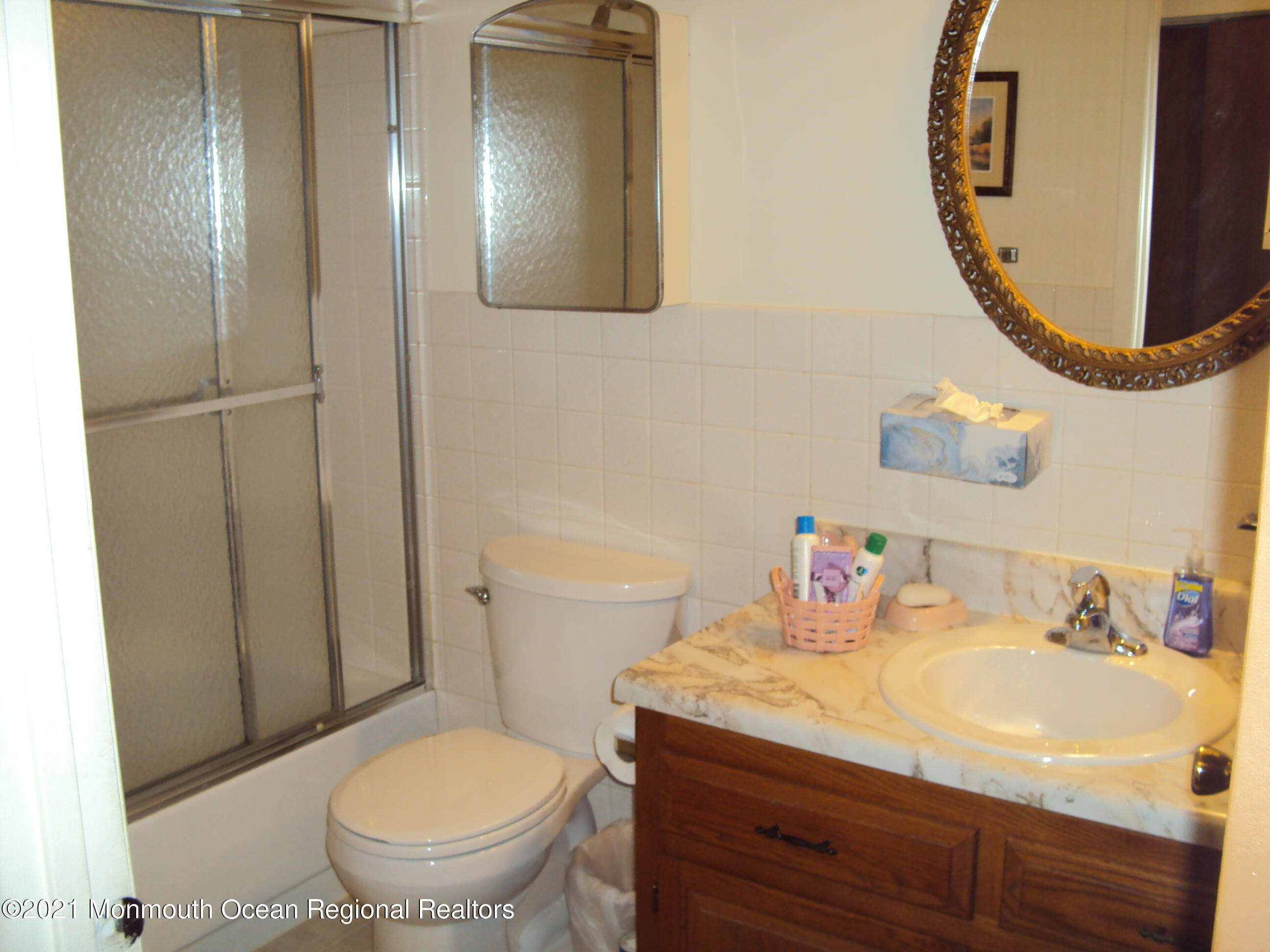 2B Stonybrook Road, Unit C Whiting, NJ 08759 - Photo 13 of 16 a bathroom with a sink and a mirror