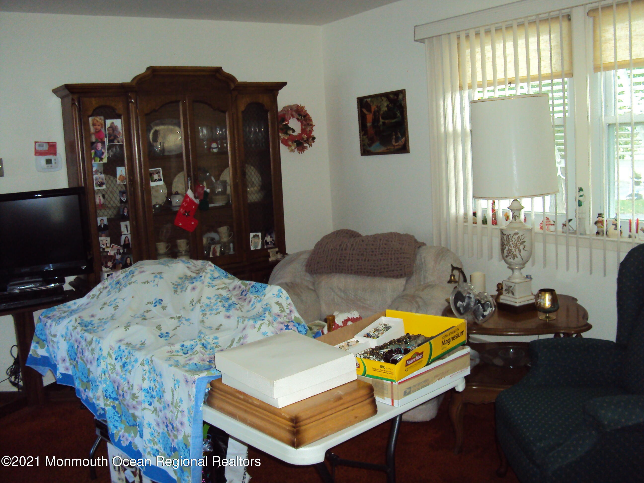 2B Stonybrook Road, Unit C Whiting, NJ 08759 - Photo 5 of 16 a living room with furniture and a flat screen tv