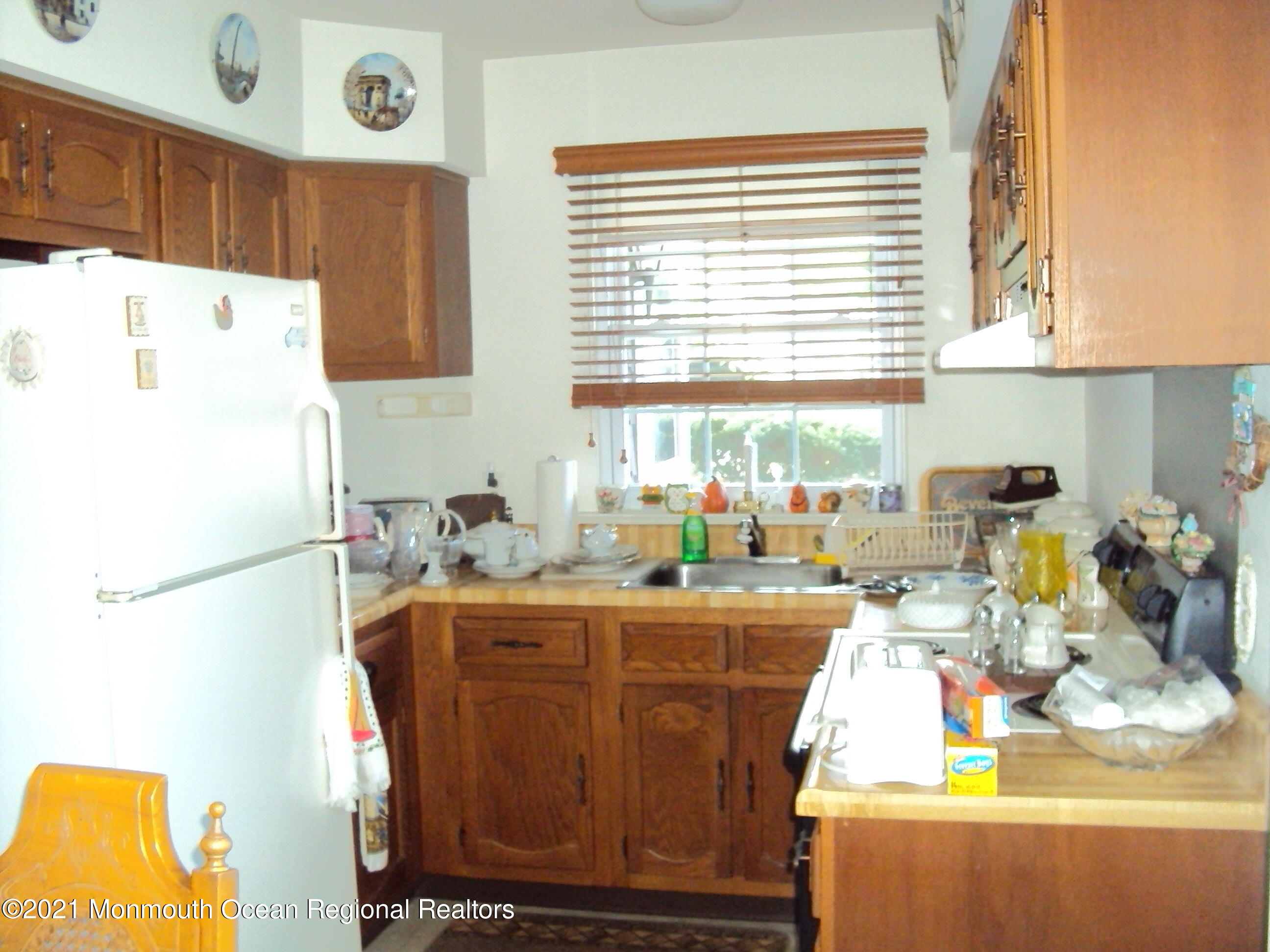 2B Stonybrook Road, Unit C Whiting, NJ 08759 - Photo 9 of 16 a kitchen with a sink a stove and a refrigerator