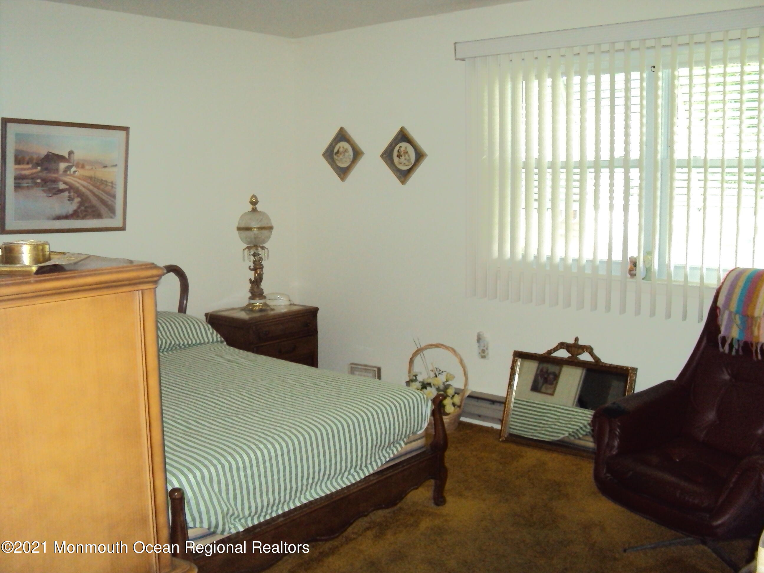2B Stonybrook Road, Unit C Whiting, NJ 08759 - Photo 10 of 16 a bedroom with a bed and wooden floor