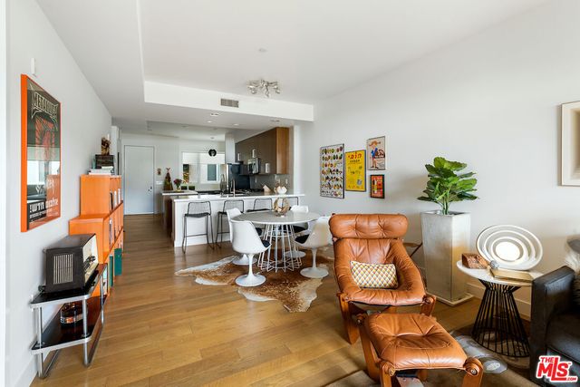 a living room with furniture a rug and a fireplace