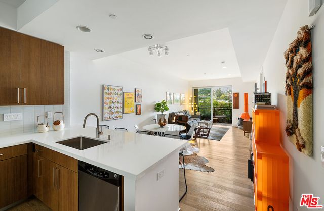 a kitchen with sink refrigerator and outdoor view