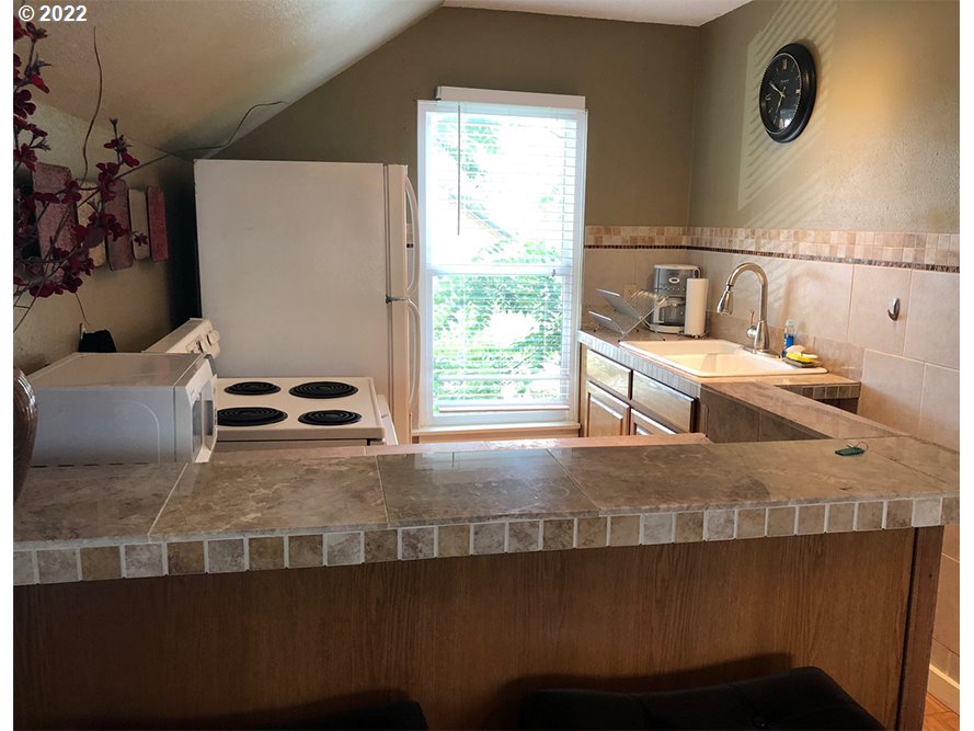 724 Southeast 3rd Street Pendleton, OR 97801 - Photo 6 of 8 a view of kitchen and sink