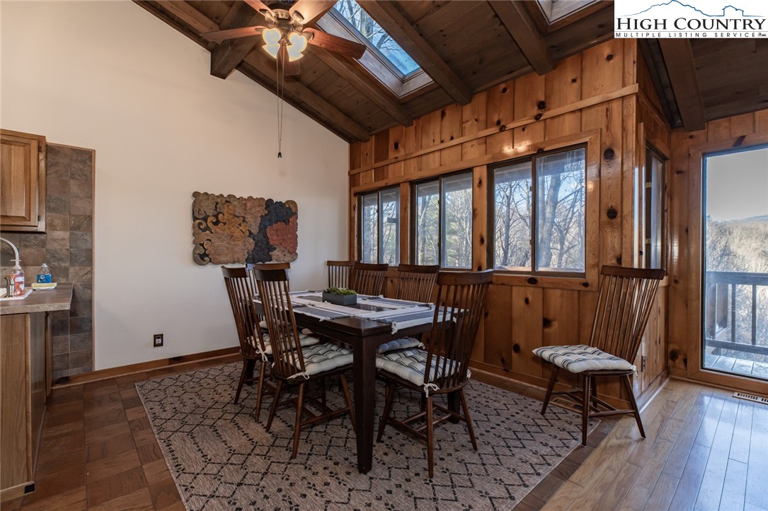 107 Buckshot Ridge Road Deep Gap, NC 28618 - Photo 12 of 30 a view of a dining room with furniture window and wooden floor