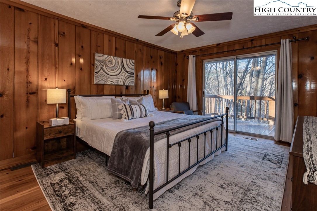 107 Buckshot Ridge Road Deep Gap, NC 28618 - Photo 19 of 30 a spacious bedroom with a bed and a window