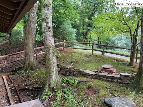 107 Buckshot Ridge Road Deep Gap, NC 28618 - Photo 3 of 30 a garden view with a seating space