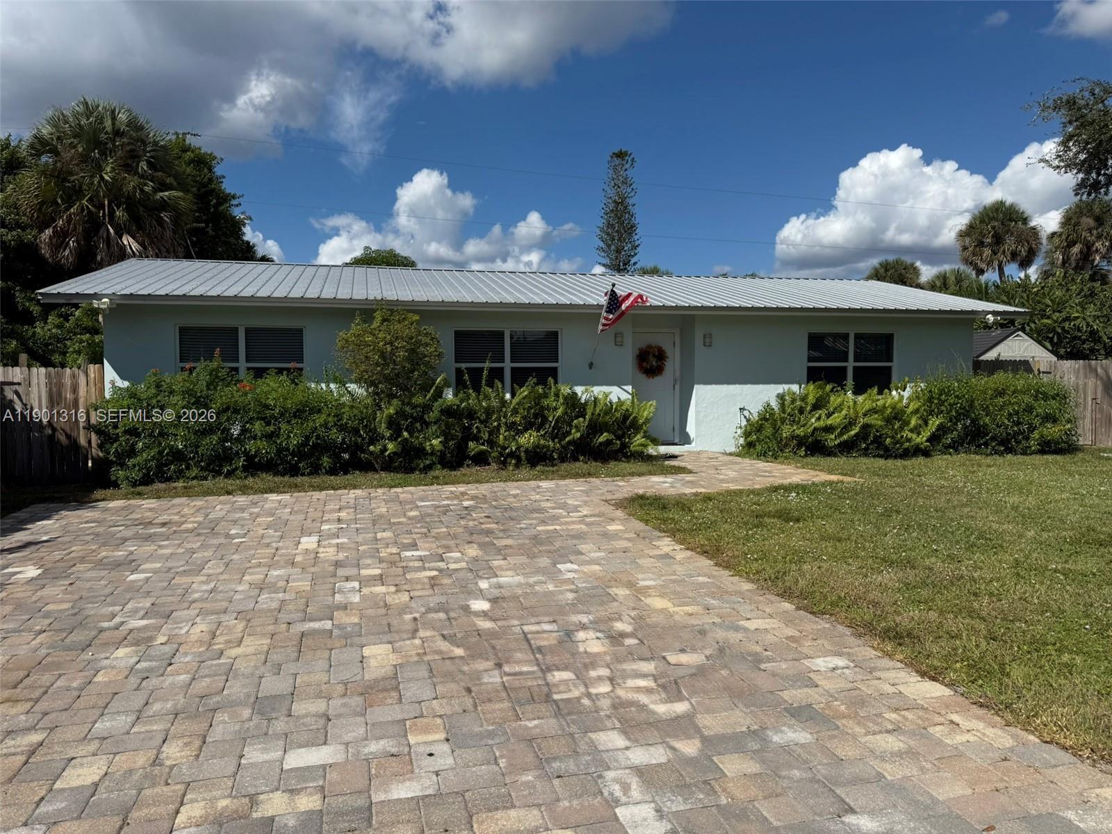 9546 Southwest Adams Avenue Okeechobee, FL 34974 - Photo 1 of 16 a view of a house with garden and a yard