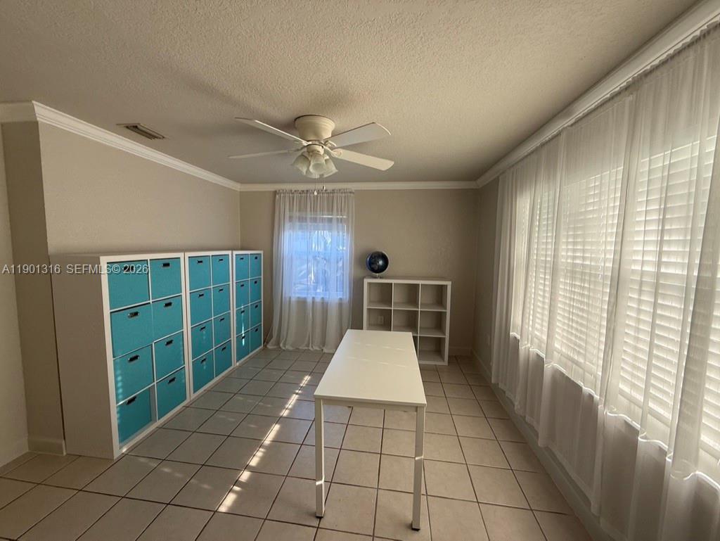 9546 Southwest Adams Avenue Okeechobee, FL 34974 - Photo 11 of 16 an empty room with windows