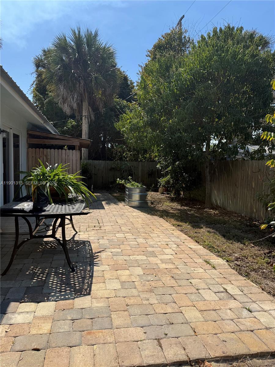 9546 Southwest Adams Avenue Okeechobee, FL 34974 - Photo 14 of 16 a view of a backyard with sitting area