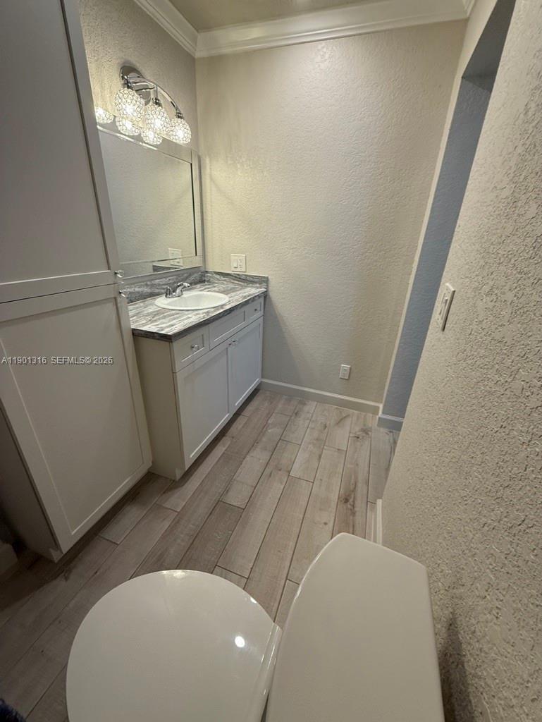 9546 Southwest Adams Avenue Okeechobee, FL 34974 - Photo 6 of 16 a bathroom with a sink and a mirror