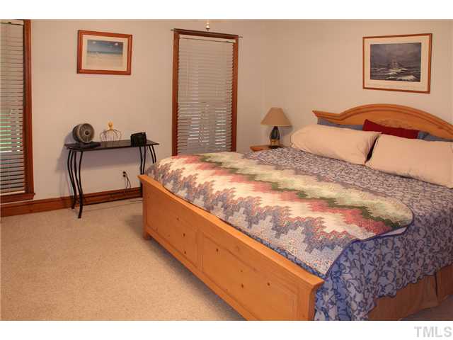 2025 Lovdal Drive Raleigh, NC 27613 - Photo 12 of 15 a bed room with a bed