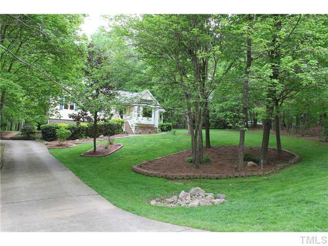 2025 Lovdal Drive Raleigh, NC 27613 - Photo 2 of 15 a front view of a house with garden