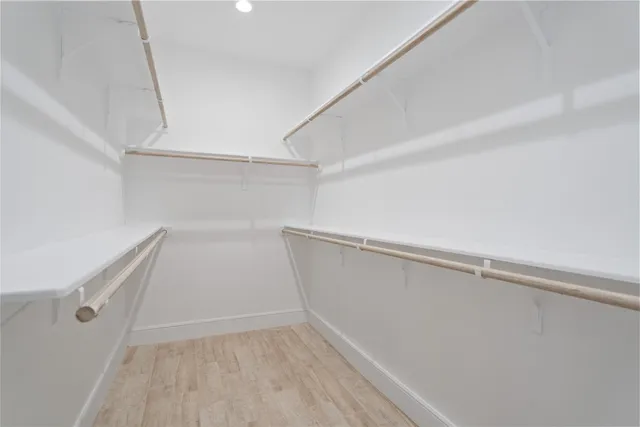 a view of an empty walk in closet