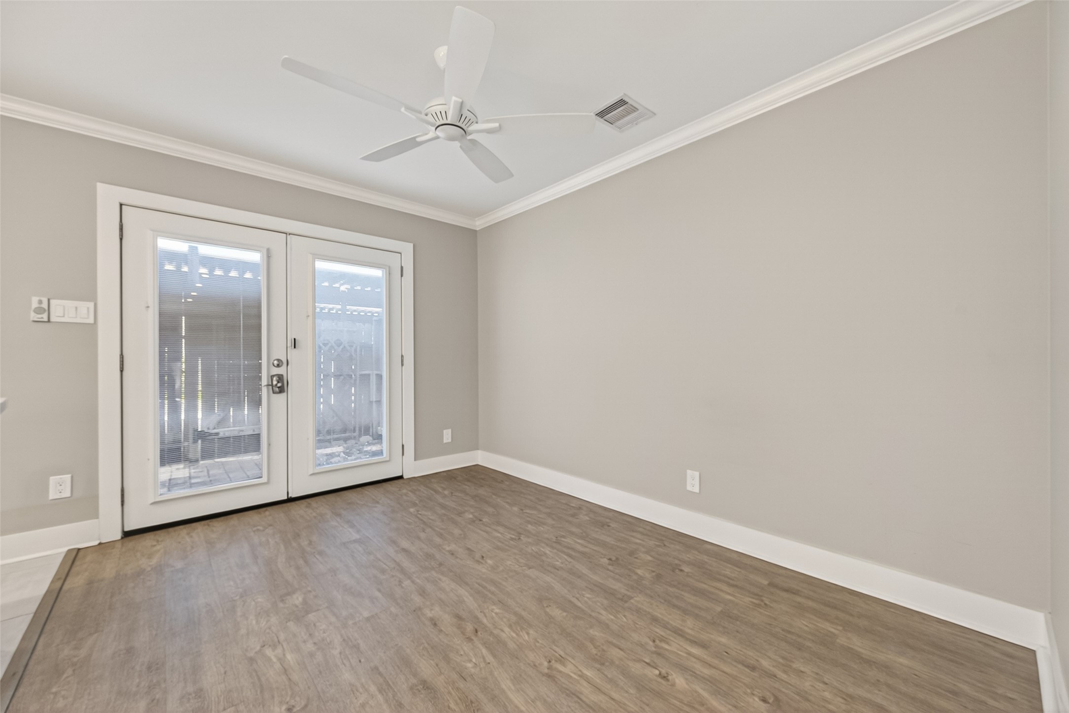 1805 Witte Road, Unit 3 Houston, TX 77080 - Photo 8 of 33 a view of an empty room with wooden floor and a window