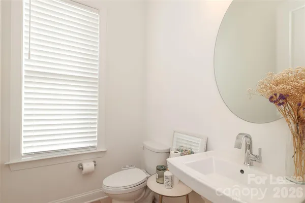 a bathroom with a toilet and a sink