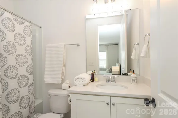 a balcony with furniture and wooden floor