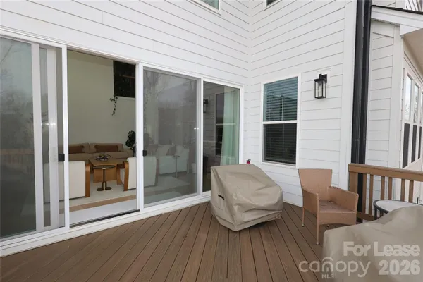 a view of balcony with furniture