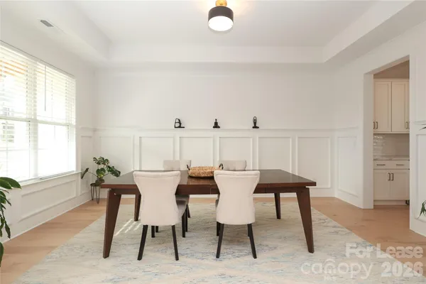 a view of a dining room with furniture and window