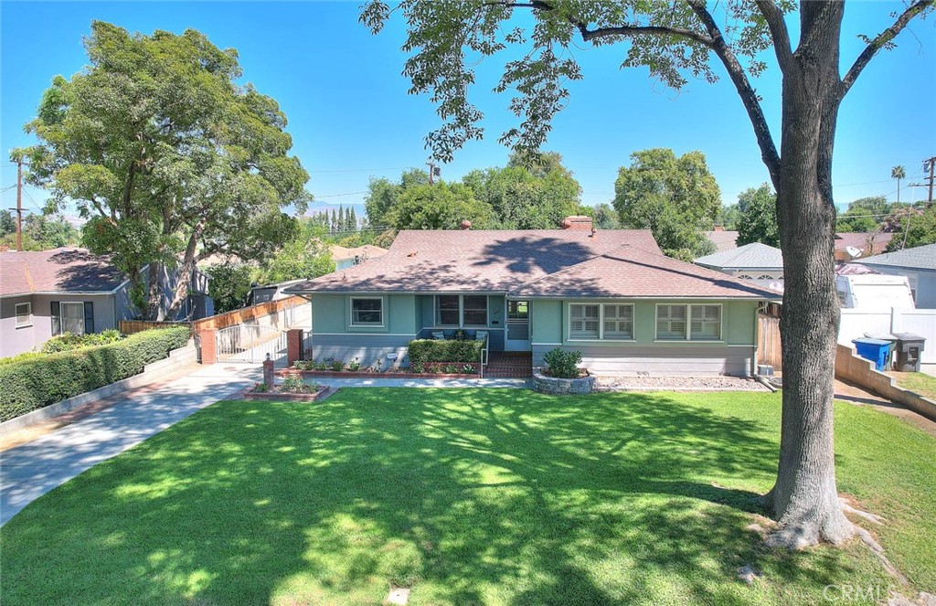 a view of a house with a yard porch and sitting area