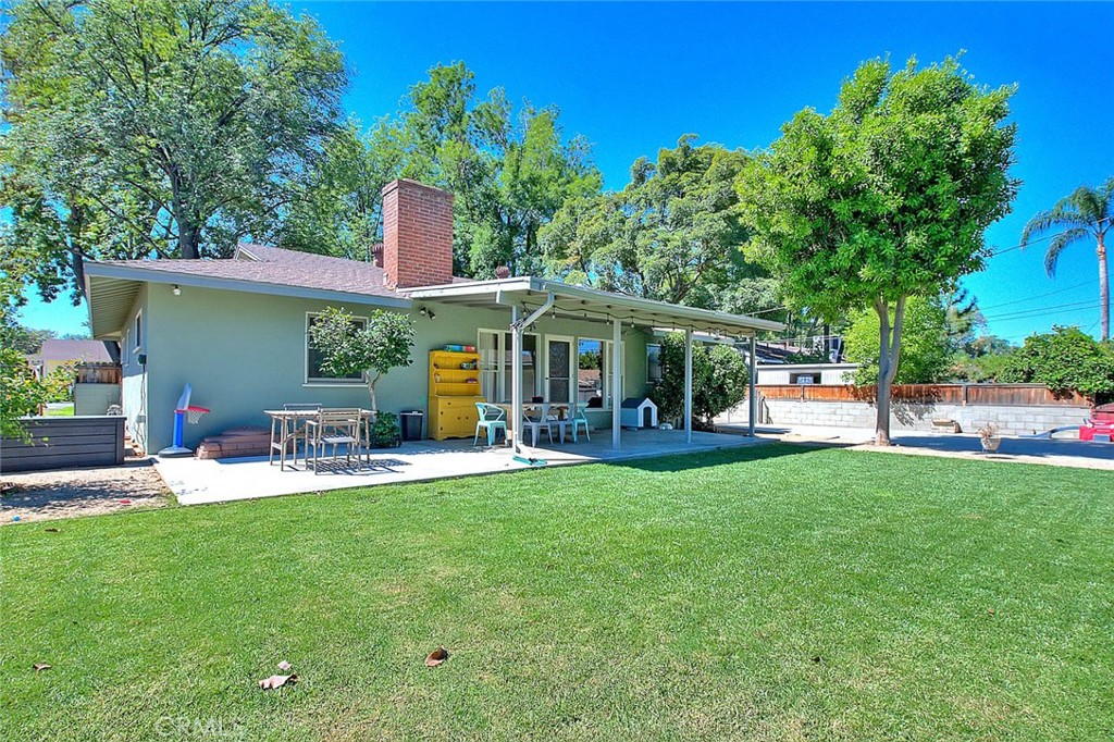 4845 Granada Avenue Riverside, CA 92504 - Photo 17 of 56 a front view of a house with a garden and patio
