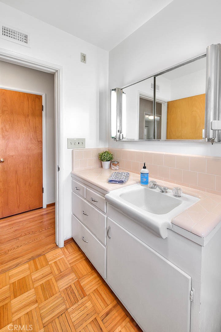 4845 Granada Avenue Riverside, CA 92504 - Photo 21 of 56 a bathroom with a sink and a mirror
