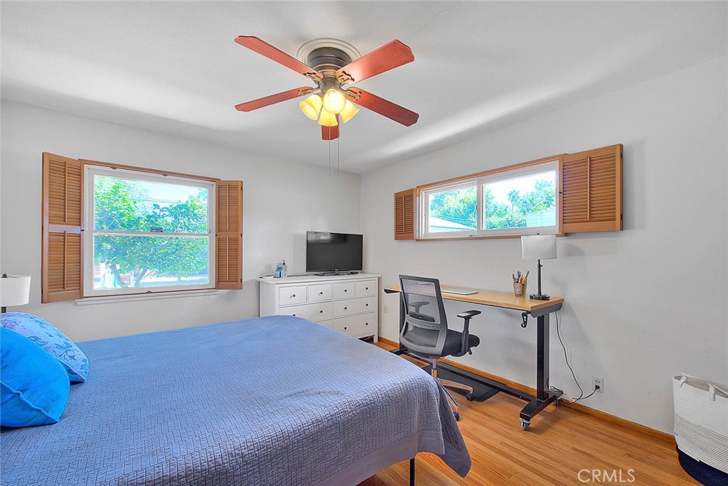 4845 Granada Avenue Riverside, CA 92504 - Photo 27 of 56 a bedroom with a bed and a desk