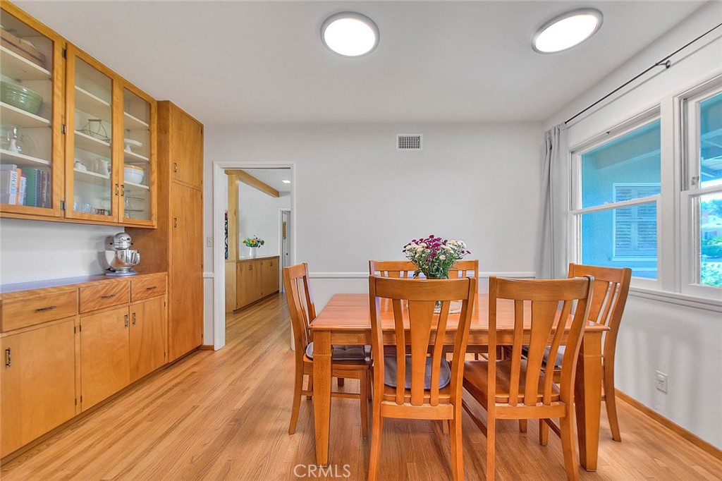 4845 Granada Avenue Riverside, CA 92504 - Photo 36 of 56 a view of a dining room with furniture and wooden floor